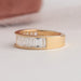 Side view of baguette cut diamond wedding band, this half eternity band crafted with yellow gold.