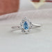 The Blue Pear Cut Halo Diamond Ring is a stunning piece of jewelry, crafted with exceptional design
