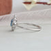 14k white gold split shank of blue oval diamond engagement ring with halo