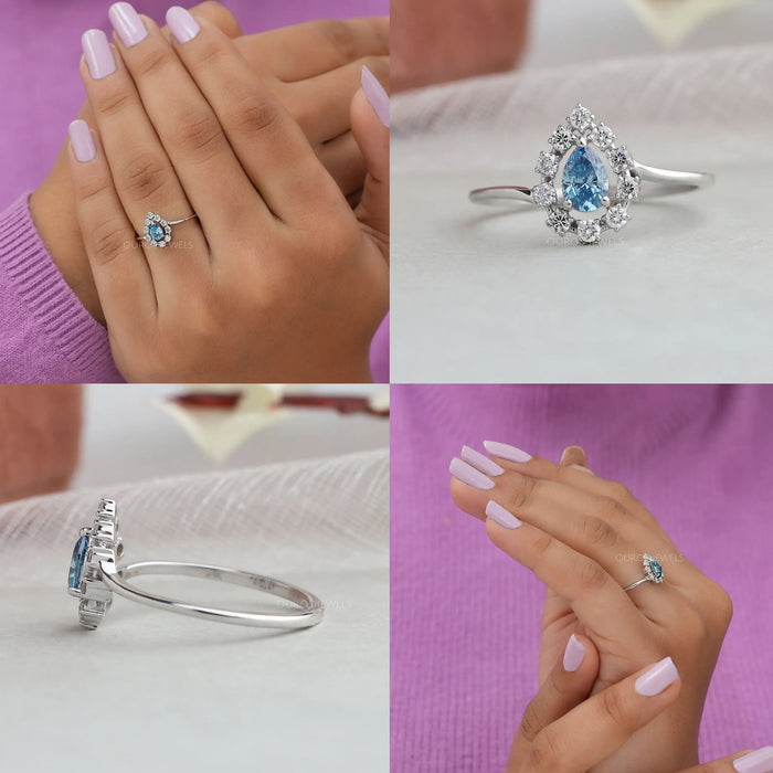 The blue pear cut halo diamond ring is a stunning piece of jewelry that exudes elegance the pear-shaped blue diamond at the center of the ring makes a bold statement and is surrounded by a halo of small diamonds that bring out its brilliant shine