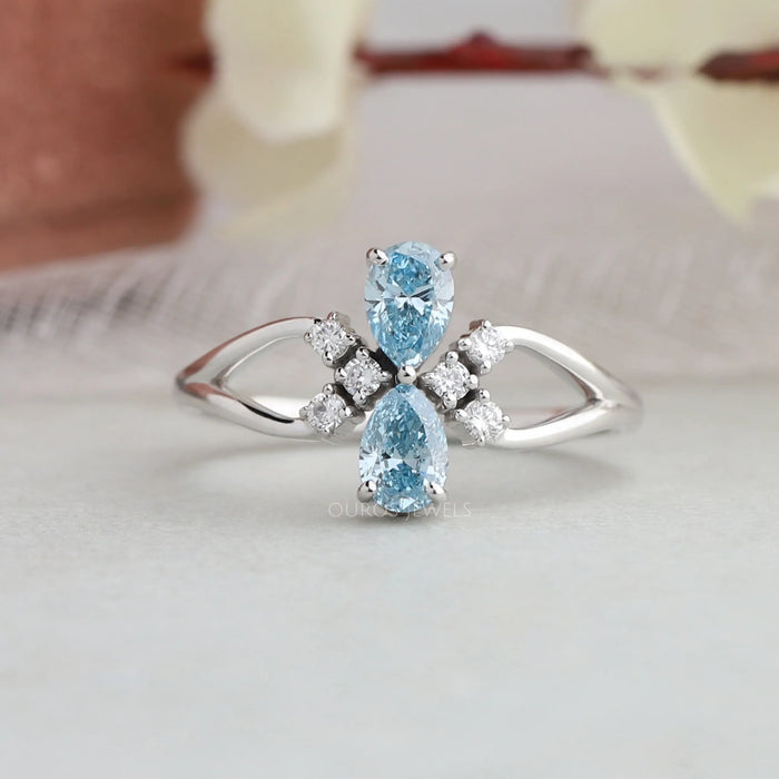 A close up look of blue pear diamond dainty wedding ring, also can be a perfect anniversary gift