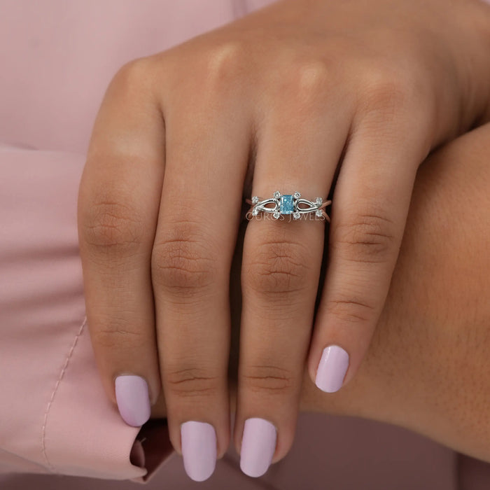 Stunning lab created diamond radiant engagement ring with fancy blue diamond