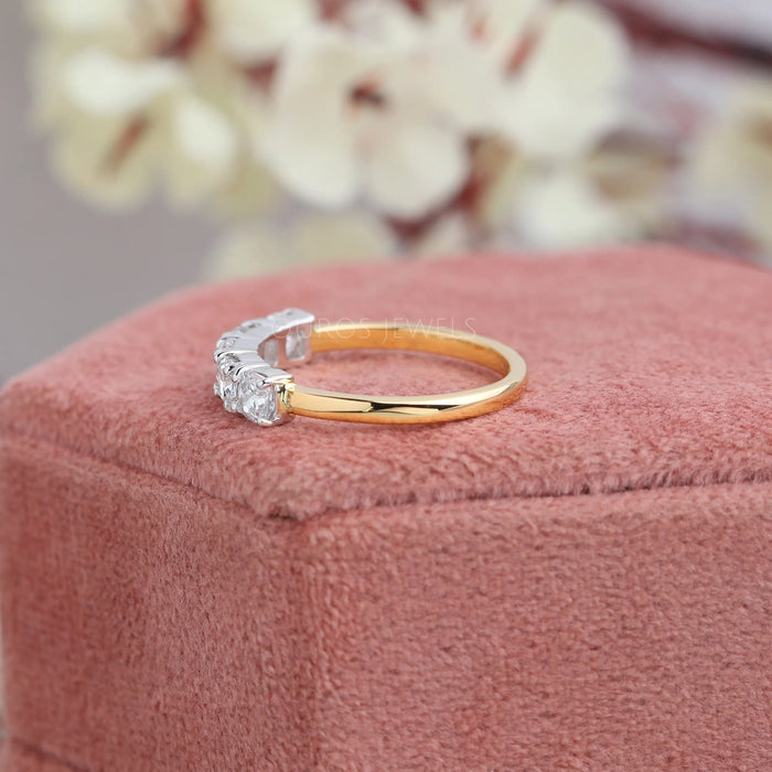 Side look of 18k yellow gold diamond wedding band with cushion cut diamonds