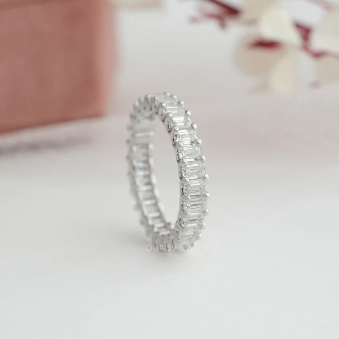 Prongs set diamond eternity ring with emerald cut lab diamonds