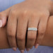In finger front look of emerald cut lab diamond half eternity wedding band