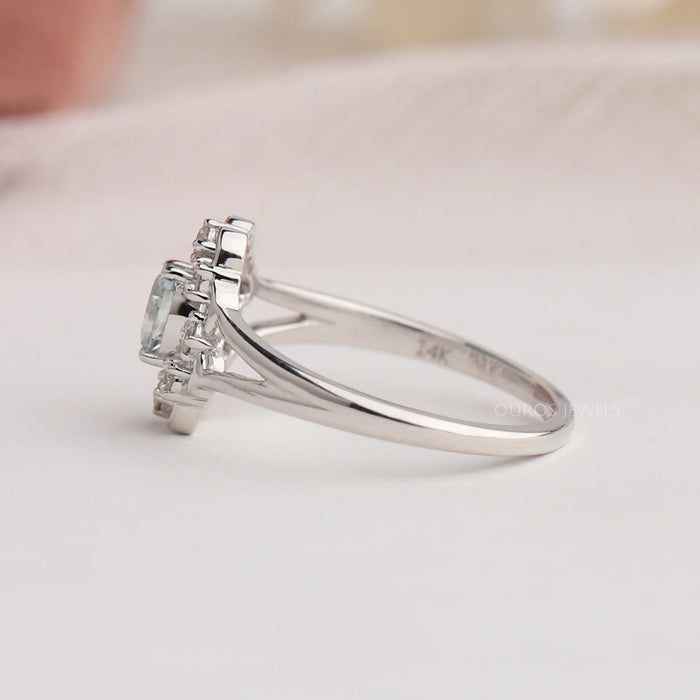 Side view of oval shaped diamond engagement ring crafted with 14k white gold, set with split shank.