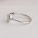 Side view of heart cut curved ring with white gold. Stunning piece of jewelry for any occasions.
