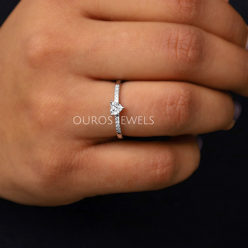 In Finger View Of Heart Shaped Solitaire Diamond Engagement Ring