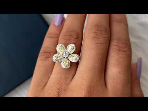 Youtube video of yellow pear diamond halo flower shaped engagement ring