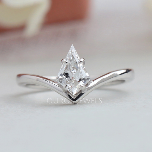 Kite cut lab grown diamond engagement ring with a curved V shape shank in white gold