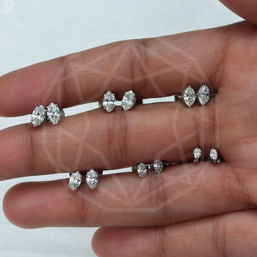 [A Women Holding Marquise Cut Studs]-[Ouros Jewels]
