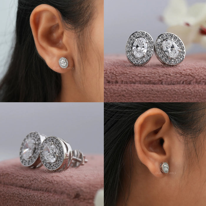 Elegant stud earrings feature fancy oval center diamonds in secure claw prong settings surrounded by a lively halo