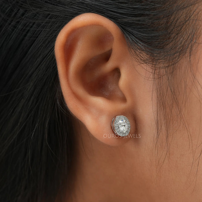 Oval cut halo lab created diamond stud earrings crafted in 14 kt white gold