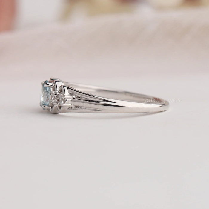 14k white gold split shank of green oval shaped lab made diamond engagement ring