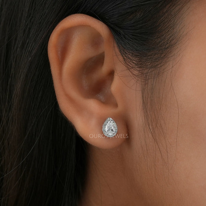 [A Women wearing Pear Haloo Diamond Stud Earrings]-[Ouros Jewels]