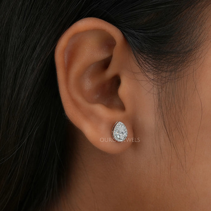 [A Women wearing Pear Cut Halo Studs]-[Ouros Jewels]