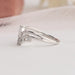 Side view of this pear shaped ring crafted with beautifully curved band.