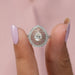 A close up look of Triple halo diamond engagement ring with brilliant pear cut lab created diamond