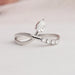 Front view of pear cut infinity dainty ring with prong set, this ring crafted with 14k white gold.