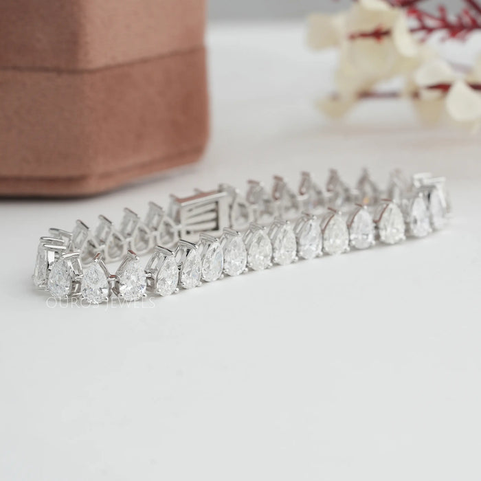 Front view of pear cut tennis bracelet in 14k white gold. This  Lab-Grown bracelet with VS clarity with colorless diamonds. 