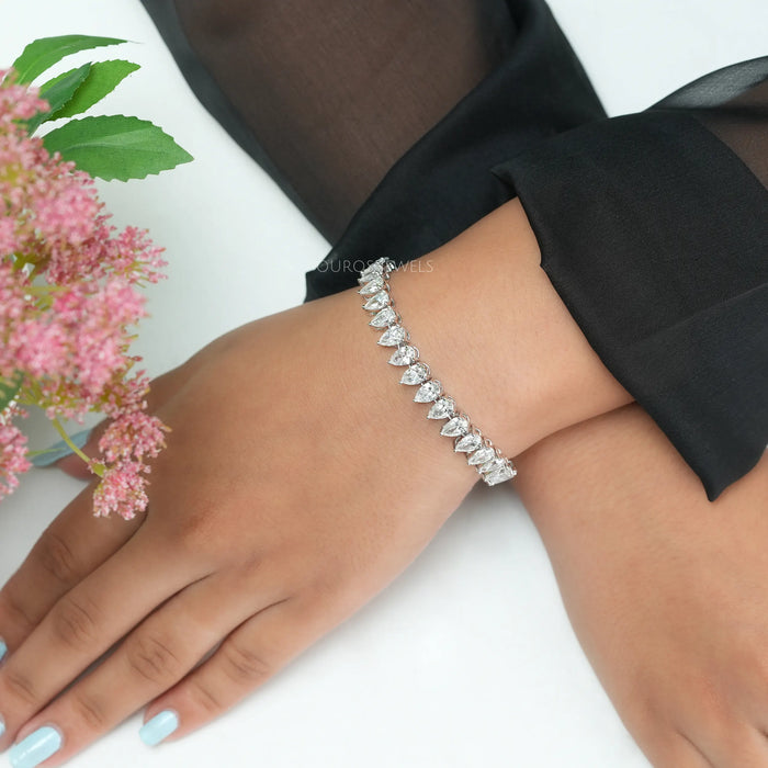 This pear cut tennis bracelet is piece of jewelry for any occasion. This bracelet gives on wrist glamourous look.