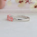 Side look of fancy pink oval shaped lab made diamond  7 stone wedding ring