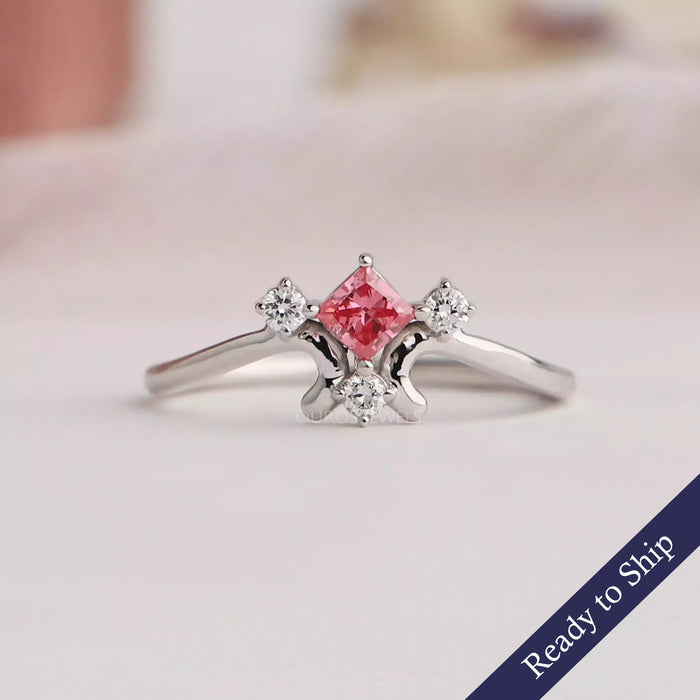 Pink princess cut lab grown diamond engagement ring with round stones and in 14k white gold