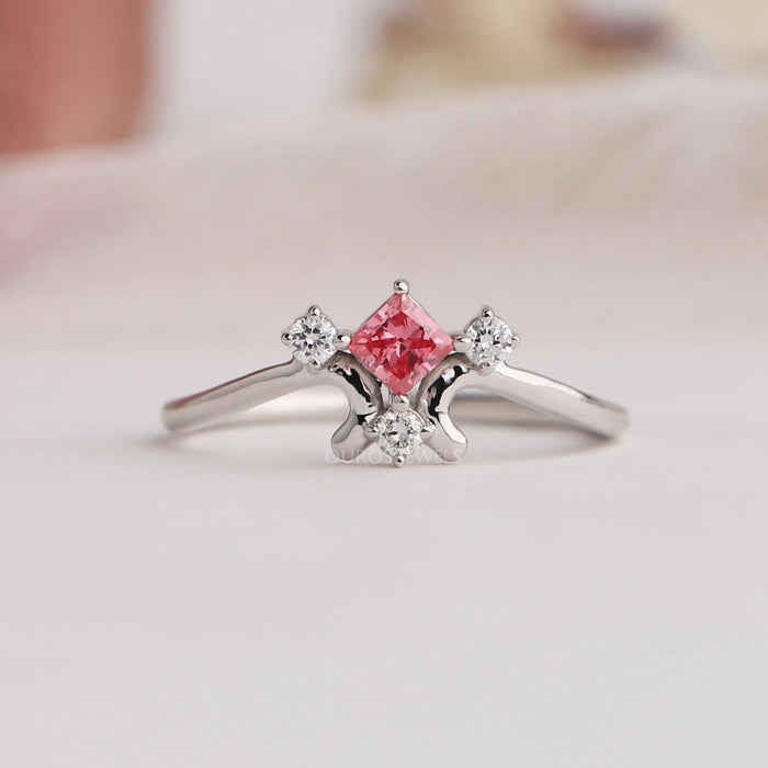 Fancy pink diamond engagement ring with pink princess diamond and traditional prongs