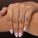 In finger front look of round cut lab made diamond engagement ring in bypass setting