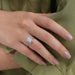In finger front look of halo engagement ring with radiant cut diamond