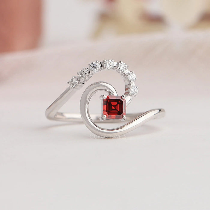 Classic asscher diamond tourbillon ring main center stone color is red shine sparkly.