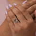 Cross hand finger view, tourbillon ring set in asscher shaped.