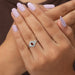 In finger look of oval engagement ring with halo