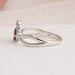 Side view of red oval shaped diamond ring, this infinity ring is stunning piece of jewelry for any ocassion.