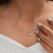 On neck front look of round cut diamond pendant necklace