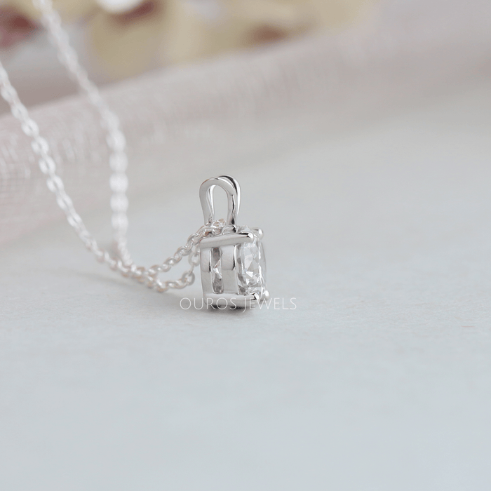 Four prong setting in solid white gold of round cut lab diamond pendant