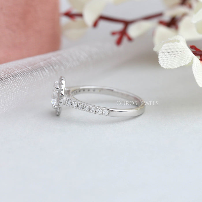 Side View Of Round Cut Halo With Side Stone Engagement Ring