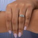 Front finger view of 3 stone emerald cut engagement ring made of 14k white gold, express your everlasting love .