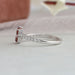 Round accent stones of red emerald cut 2 stone wedding band