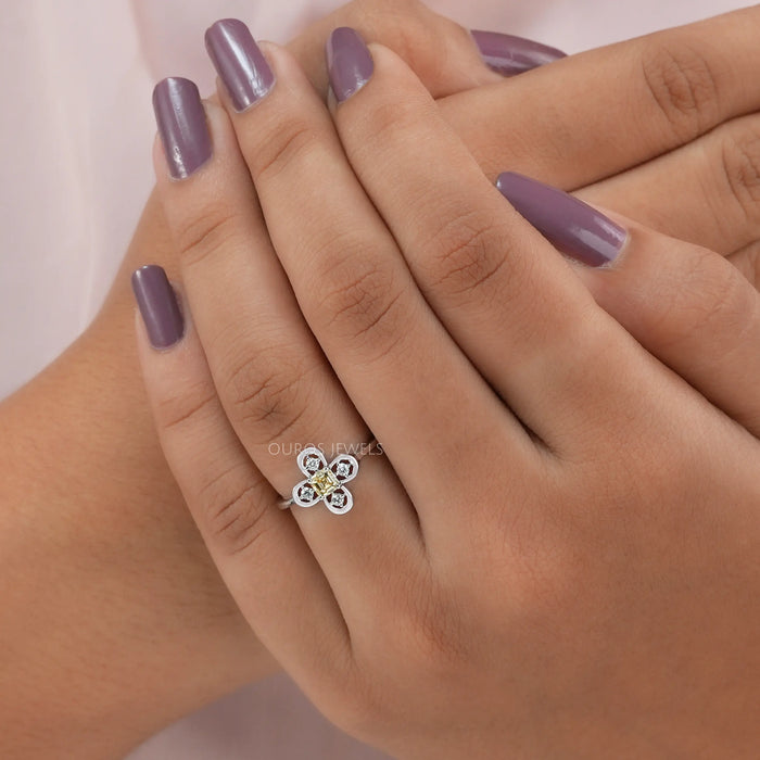 Cross finger view of asscher cut diamond ring, this stunning jewelry piece of  any occasion. 