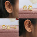 Exquisite stud earrings feature a yellow lab diamond with a princess cut set in a classic four-prong setting of 14k yellow gold