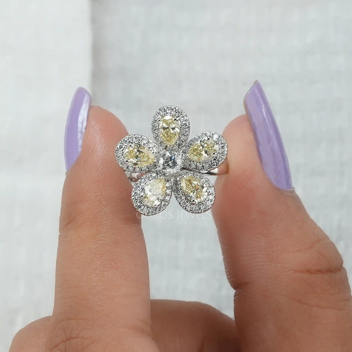 Shimmering white gold pear halo flower style engagement ring, perfect ring for any special occasion
