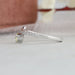 14k white gold shank studded with round accent stones of pear cut diamond engagement ring